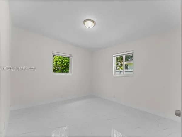 an empty room with windows