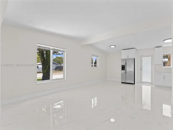 a view of an empty room with a window