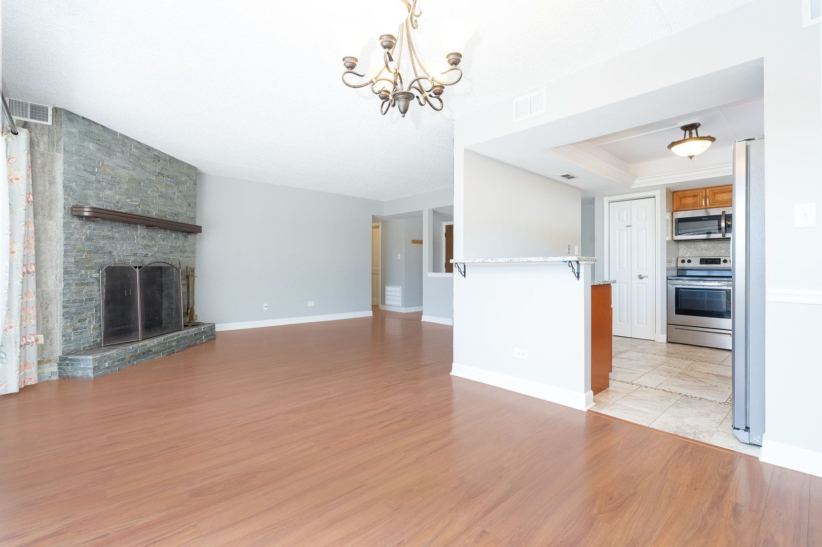 11137 E Road, Unit C Palos Hills, IL 60465 - Photo 14 of 29 a view of a kitchen with a sink and a refrigerator