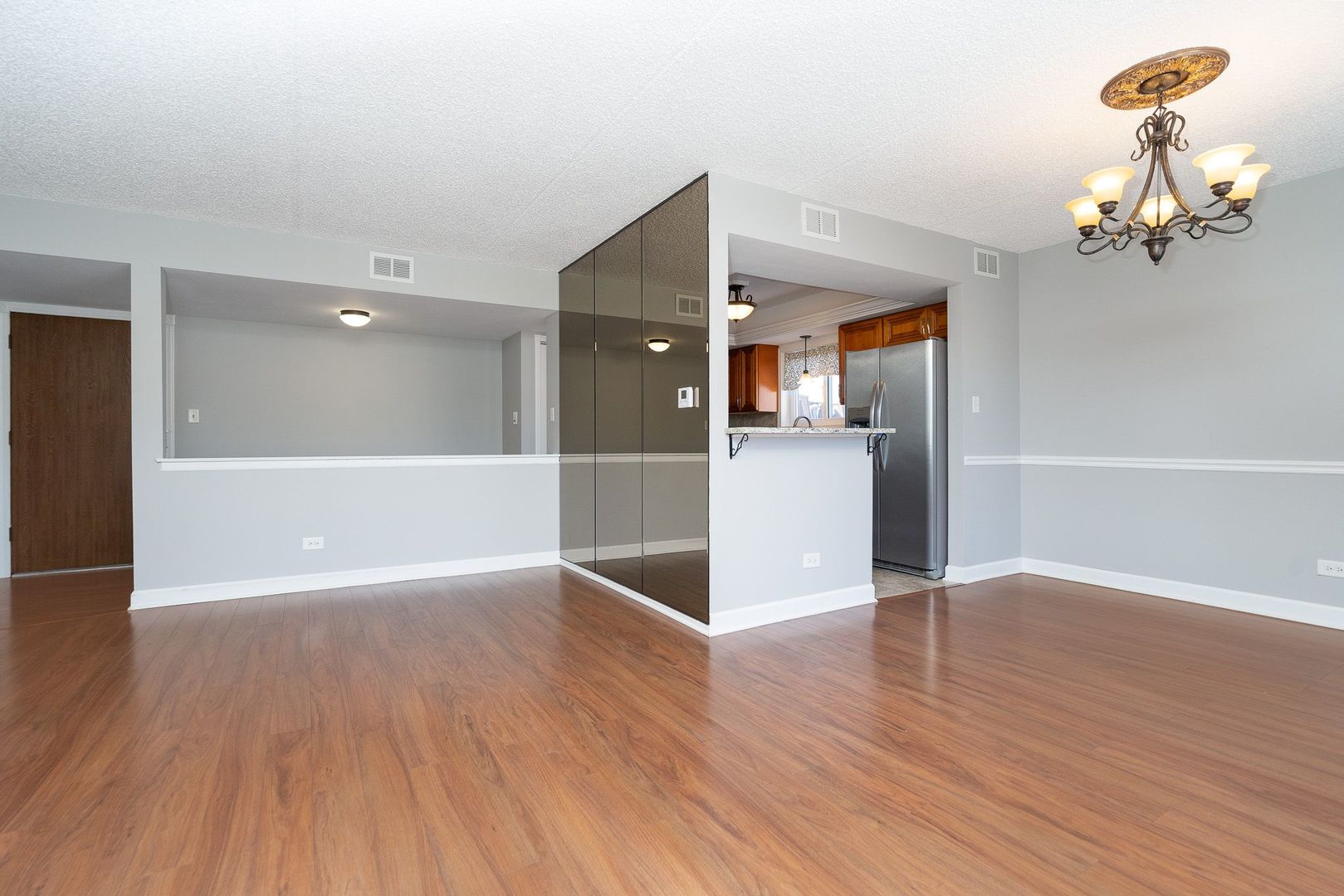 11137 E Road, Unit C Palos Hills, IL 60465 - Photo 15 of 29 a view of a livingroom with wooden floor