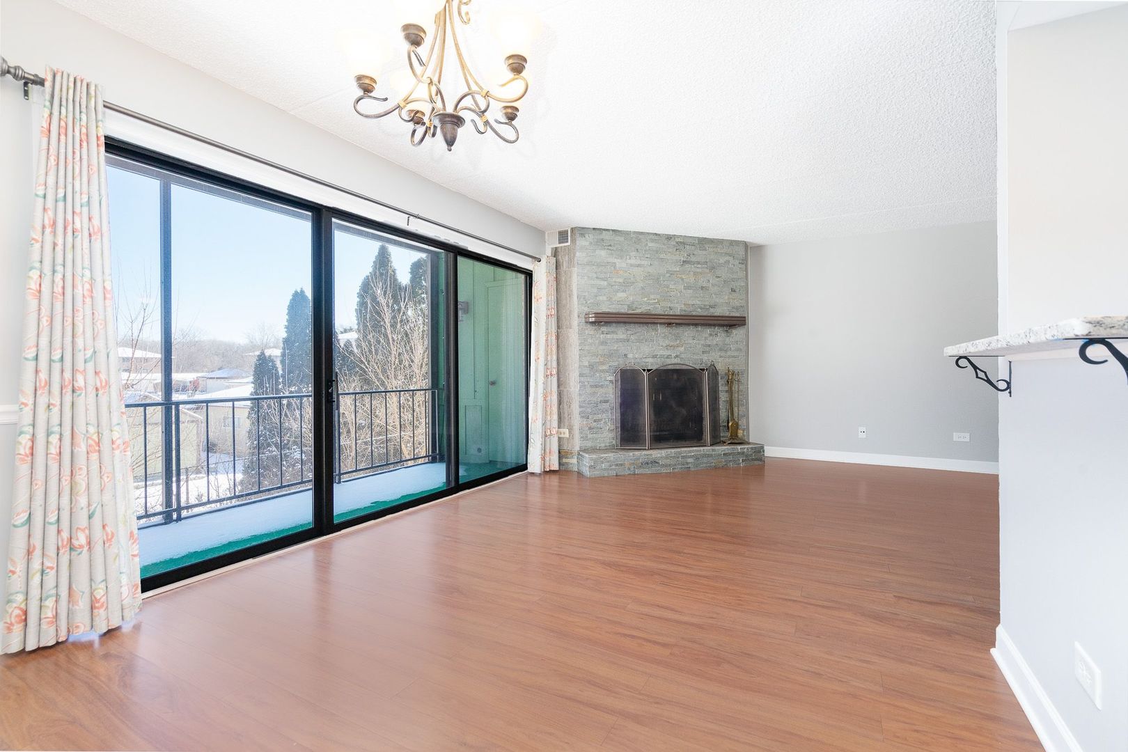 11137 E Road, Unit C Palos Hills, IL 60465 - Photo 17 of 29 a view of an empty room with a fireplace