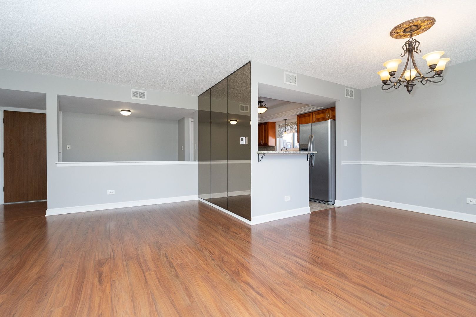 11137 E Road, Unit C Palos Hills, IL 60465 - Photo 18 of 29 a view of a livingroom with wooden floor