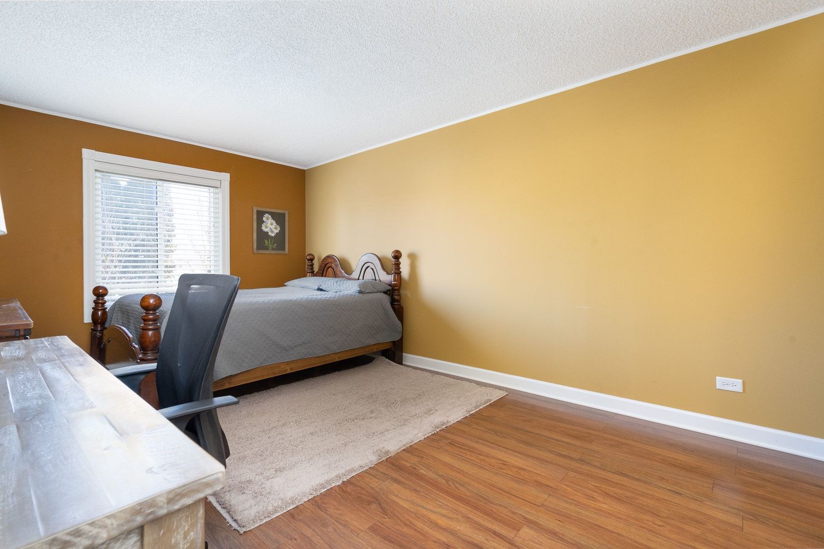 11137 E Road, Unit C Palos Hills, IL 60465 - Photo 23 of 29 a bed room with a bed and a chair