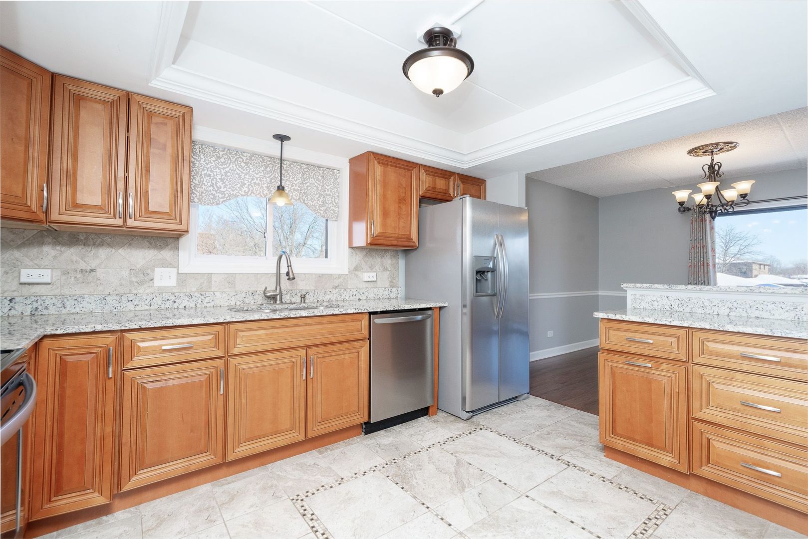 11137 E Road, Unit C Palos Hills, IL 60465 - Photo 10 of 29 a kitchen with stainless steel appliances granite countertop a sink and cabinets