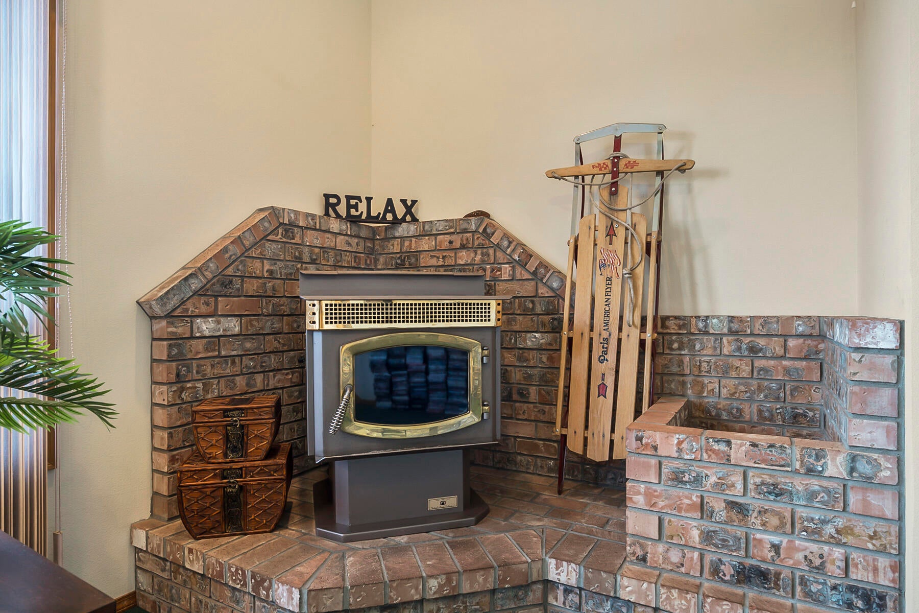 3808 Northwest Summerfield Road Bend, OR 97703 - Photo 22 of 38 Warm pellet stove with brick storage area.
