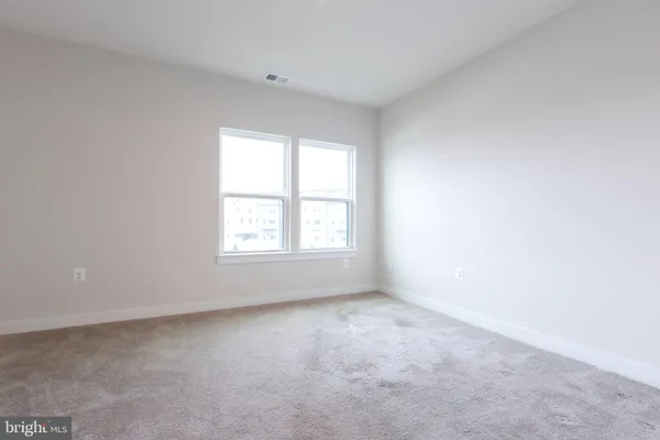 a utility room with cabinets washer and dryer