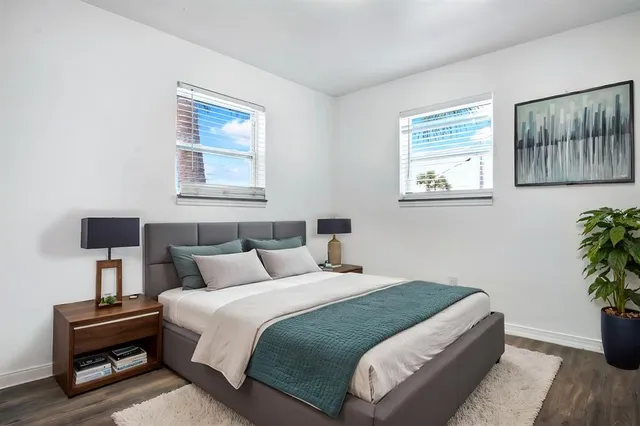 a bedroom with bed and window