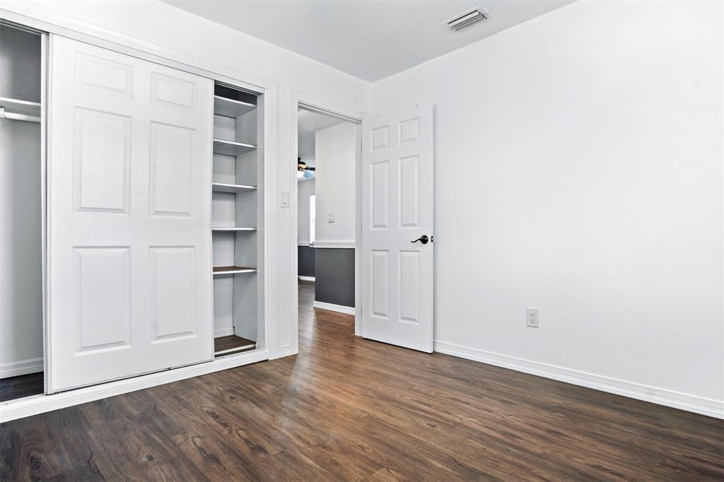 101 Northeast 35th Street, Unit A Pompano Beach, FL 33064 - Photo 15 of 23 a view of empty room with wooden floor