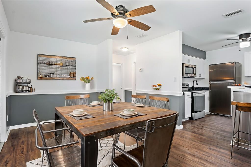 101 Northeast 35th Street, Unit A Pompano Beach, FL 33064 - Photo 7 of 23 a view of a dining room with furniture and wooden floor