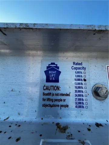 a view of a yard with wooden fence