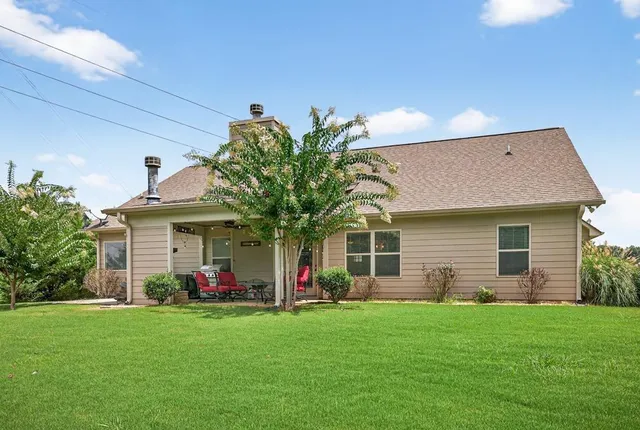a front view of house with an outdoor seating