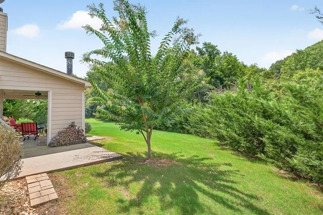 a view of a backyard with a patio