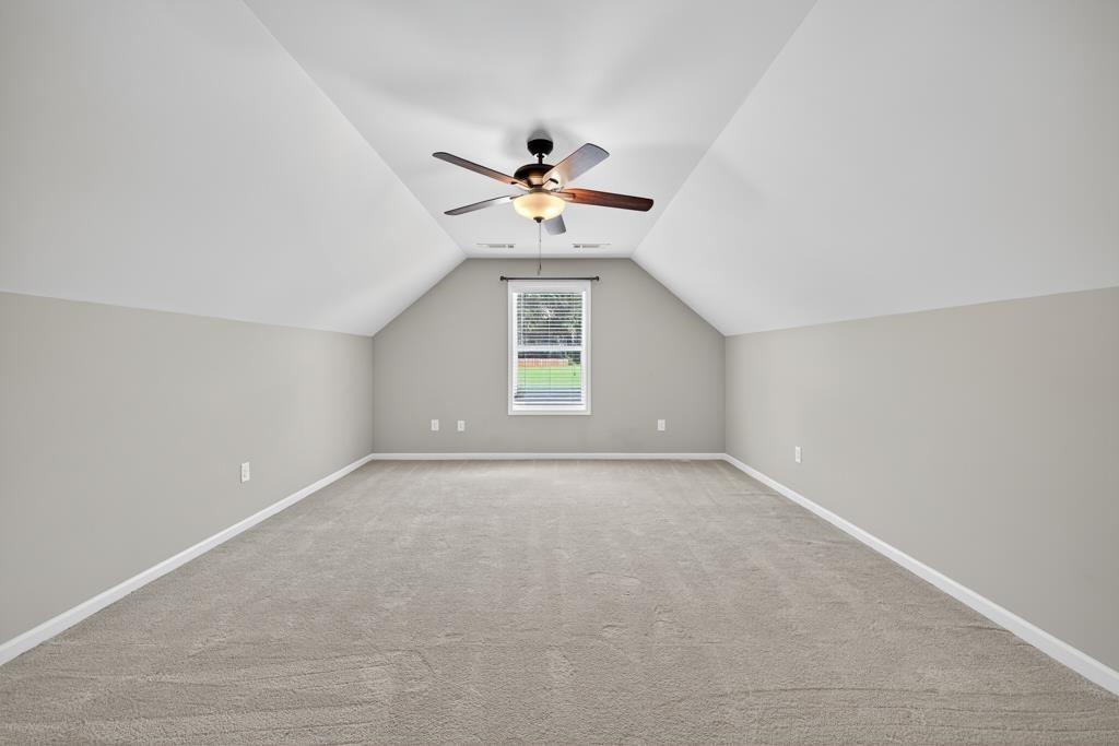 445 Katherine Drive Jefferson, GA 30549 - Photo 18 of 41 wooden floor in an empty room with a window