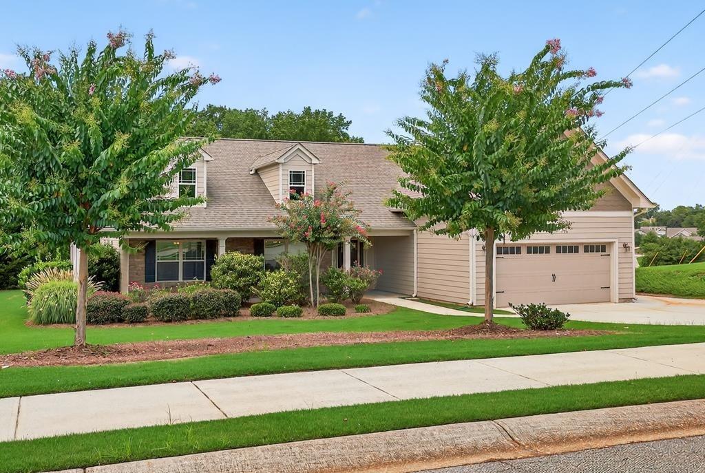 445 Katherine Drive Jefferson, GA 30549 - Photo 2 of 41 a front view of a house with a yard and plants