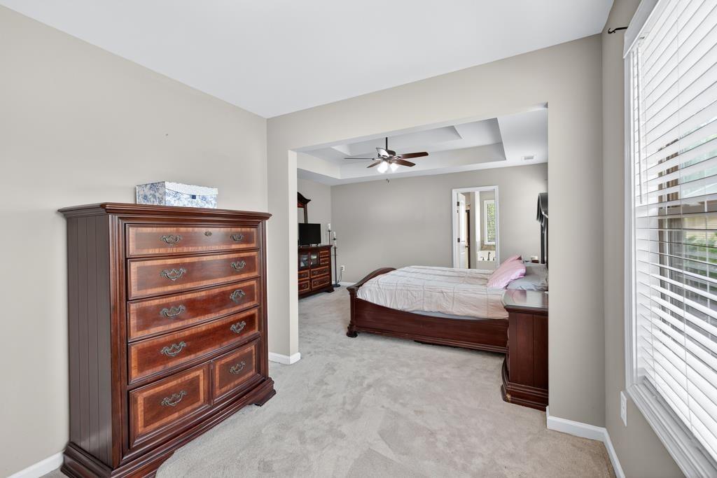 445 Katherine Drive Jefferson, GA 30549 - Photo 23 of 41 a bedroom with a bed and a cabinets