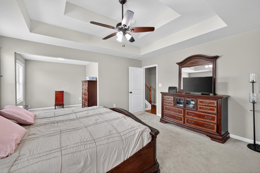 445 Katherine Drive Jefferson, GA 30549 - Photo 26 of 41 a bedroom with a bed and a flat screen tv