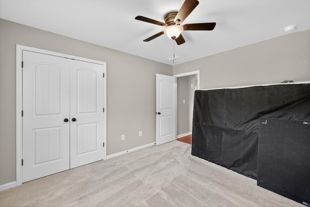 445 Katherine Drive Jefferson, GA 30549 - Photo 29 of 41 en empty room with fan and window