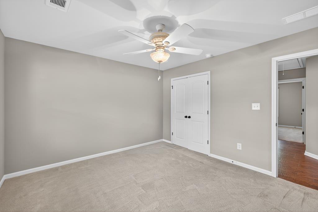 445 Katherine Drive Jefferson, GA 30549 - Photo 33 of 41 a view of an empty room and a ceiling fan