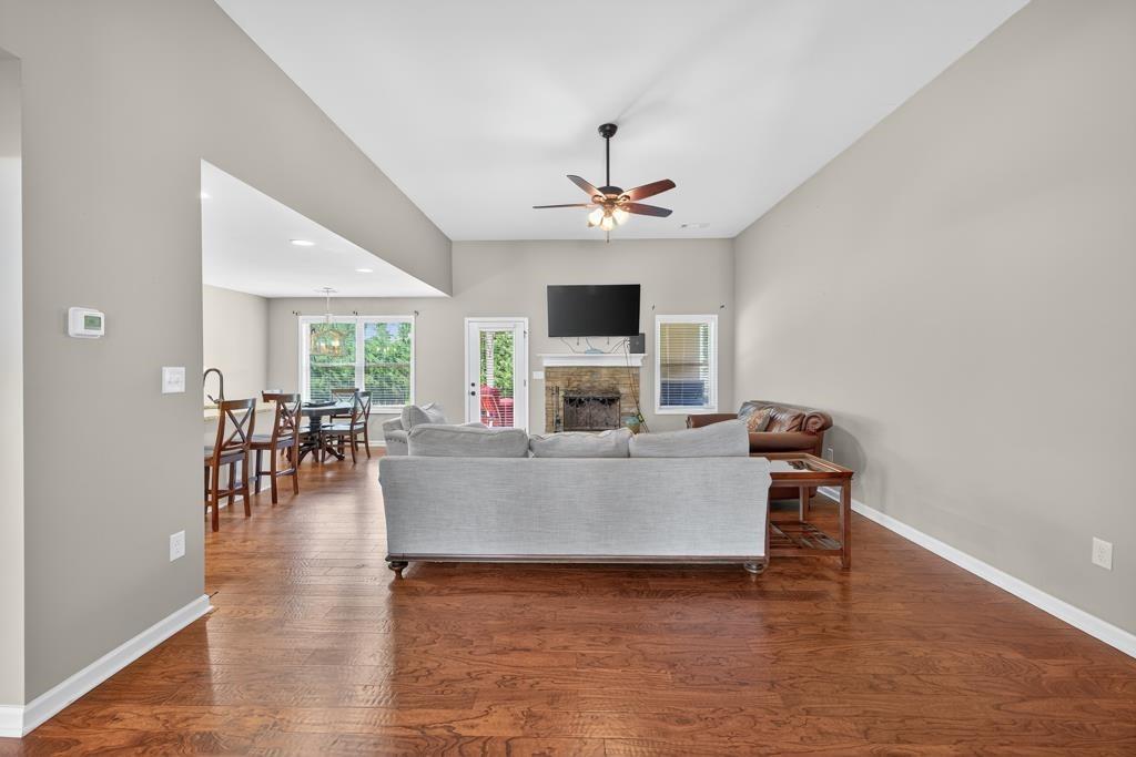 445 Katherine Drive Jefferson, GA 30549 - Photo 7 of 41 a living room with furniture and a fireplace