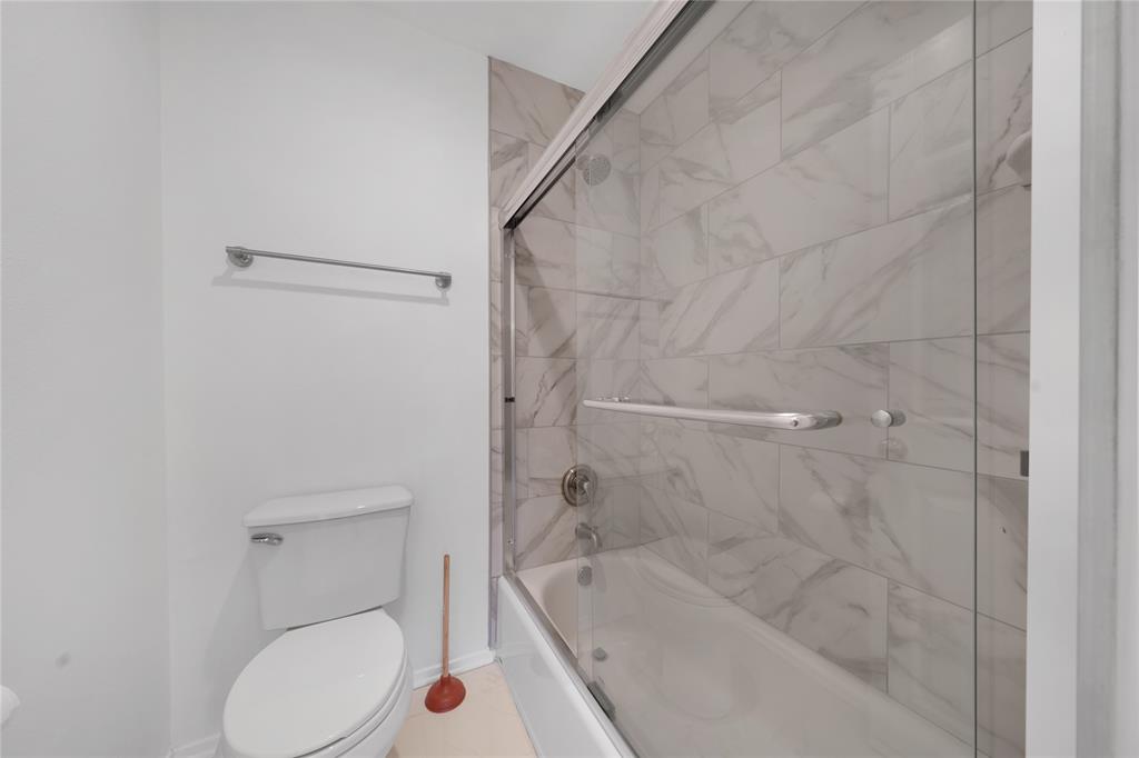 5626 Preston Oaks Road, Unit 16D Dallas, TX 75254 - Photo 14 of 29 a bathroom with a tub and toilet