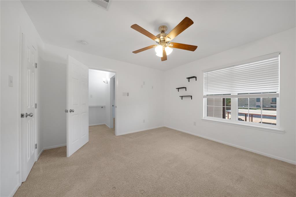 5626 Preston Oaks Road, Unit 16D Dallas, TX 75254 - Photo 16 of 29 a view of empty room with window