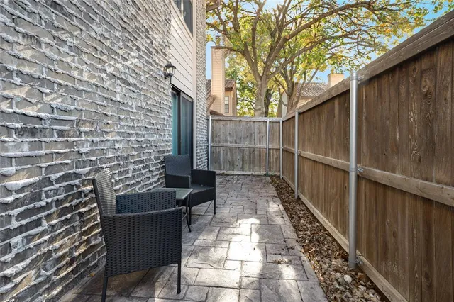 a view of a pathway with a wooden fence