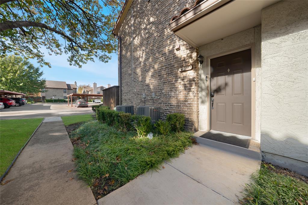 5626 Preston Oaks Road, Unit 16D Dallas, TX 75254 - Photo 25 of 29 a porch with seating space and yard