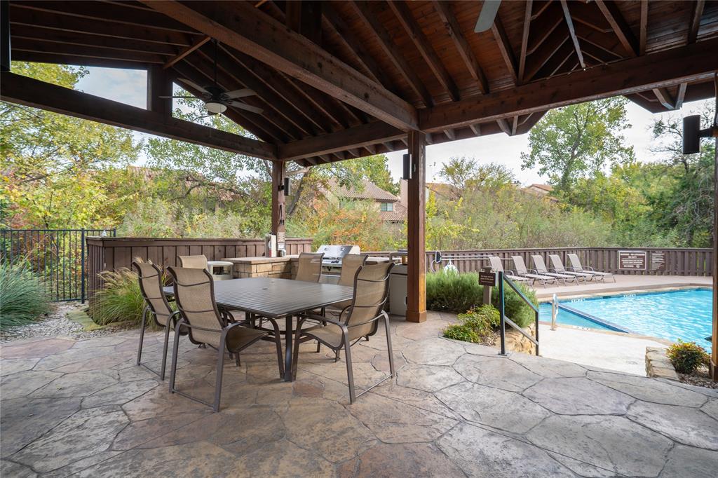 5626 Preston Oaks Road, Unit 16D Dallas, TX 75254 - Photo 27 of 29 a view of a porch with furniture and a yard