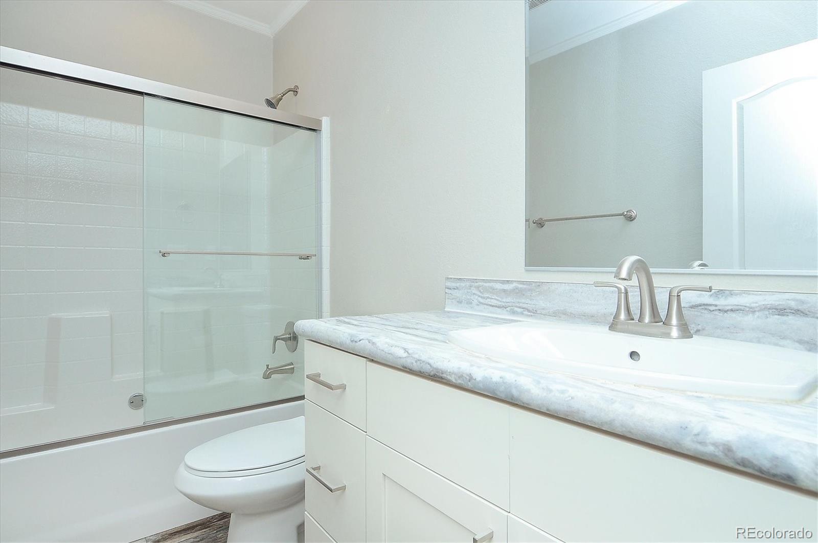 16554 Rocky Mountain Road Salida, CO 81201 - Photo 18 of 33 a bathroom with a granite countertop sink toilet and shower
