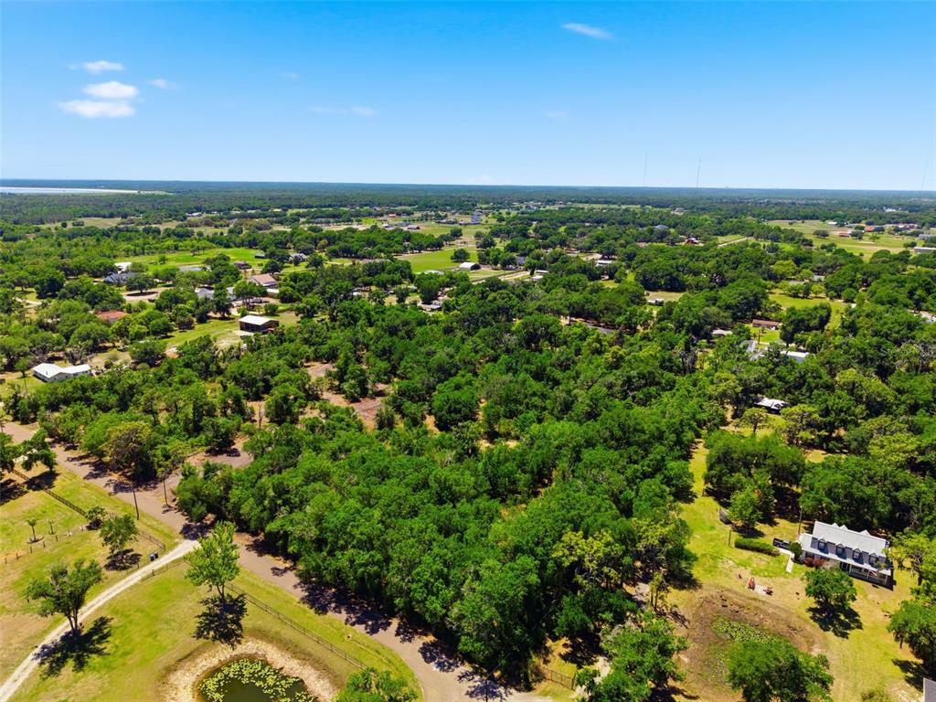 19084 Red Bird Lane, Unit LOT 5 Lithia, FL 33547 - Photo 18 of 21 an aerial view of residential houses with outdoor space