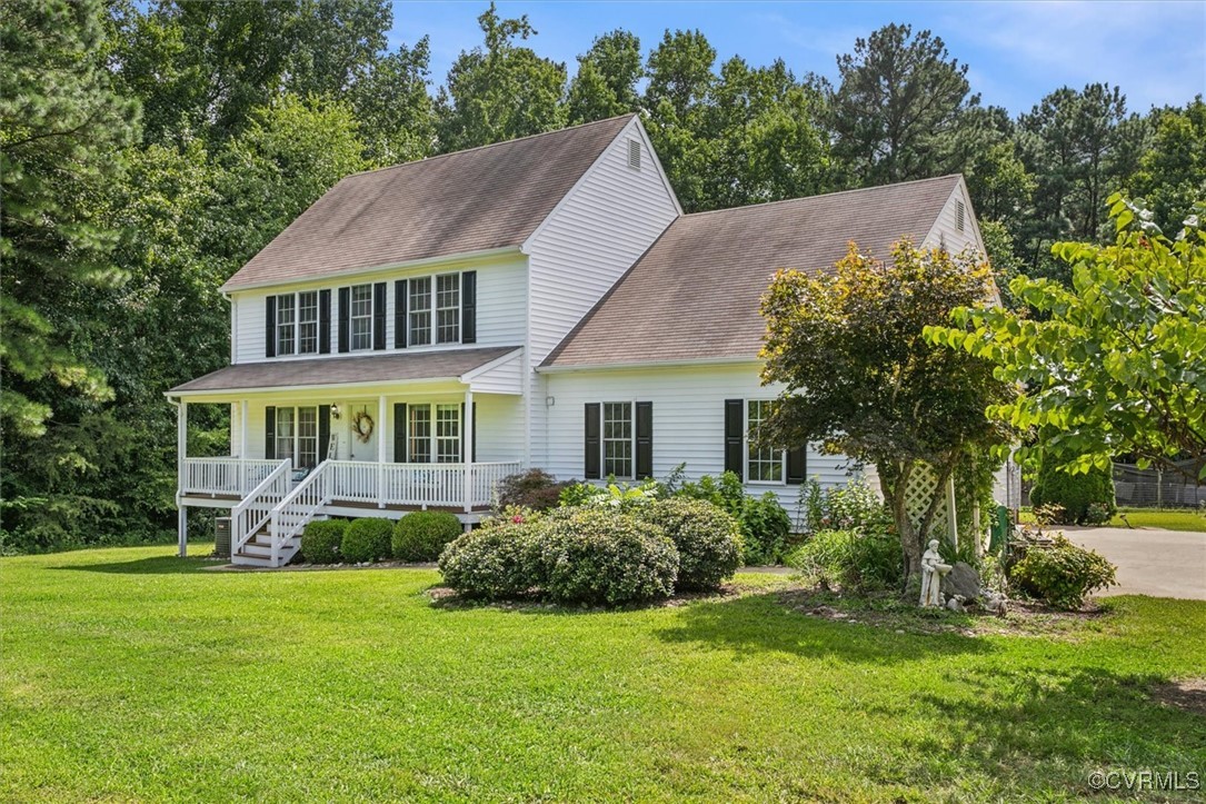 203 Oaktree Road, Unit A Williamsburg, VA 23188 - Photo 1 of 46 Colonial home with a porch and a front lawn