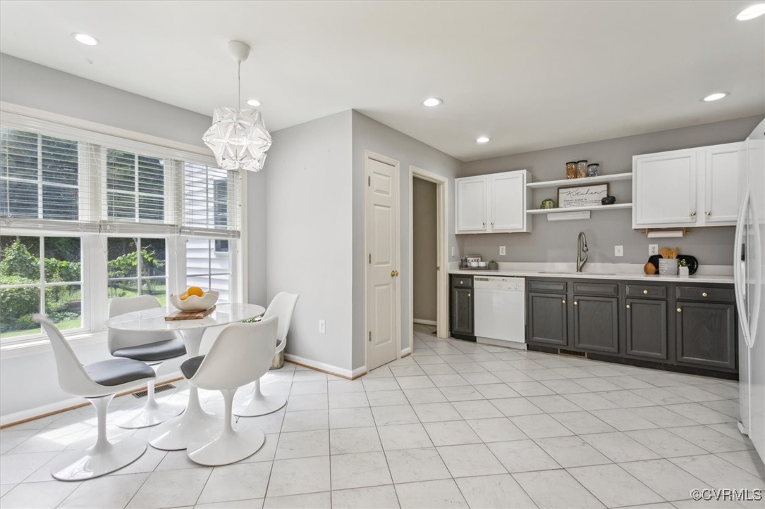 203 Oaktree Road, Unit A Williamsburg, VA 23188 - Photo 16 of 46 Kitchen featuring pendant lighting, sink, fridge,