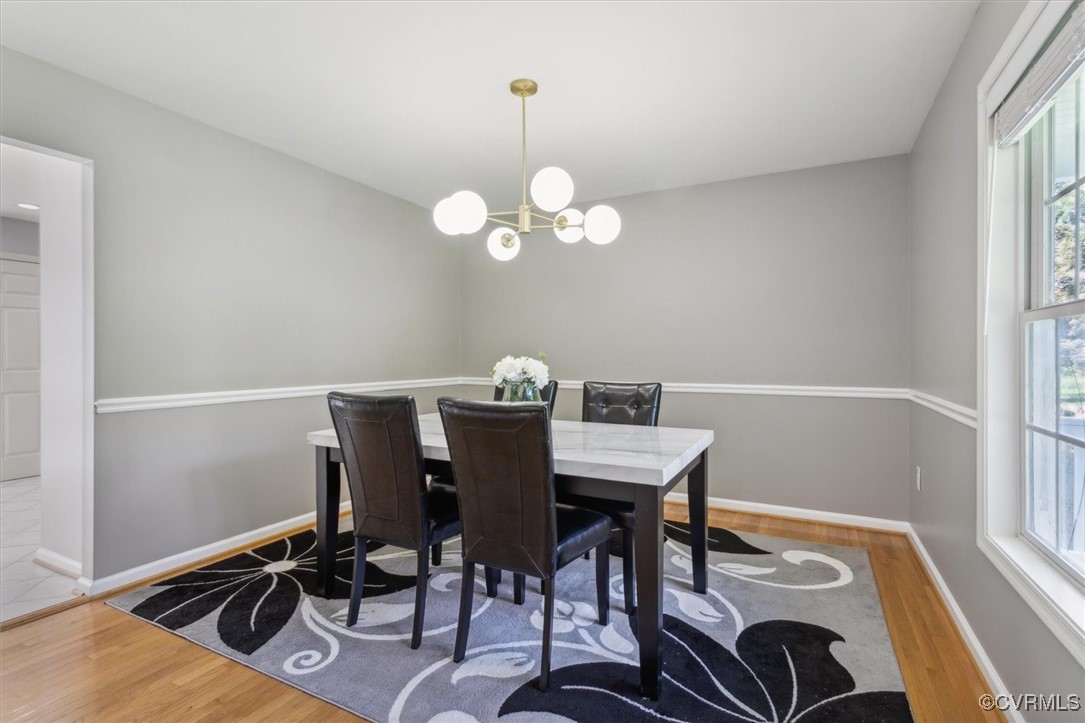 203 Oaktree Road, Unit A Williamsburg, VA 23188 - Photo 21 of 46 Dining area with a chandelier and hardwood / wood-