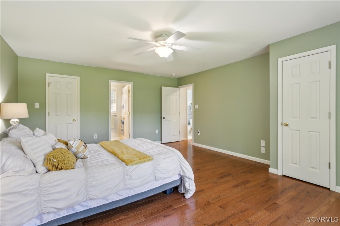 203 Oaktree Road, Unit A Williamsburg, VA 23188 - Photo 25 of 46 Bedroom featuring connected bathroom, dark hardwoo
