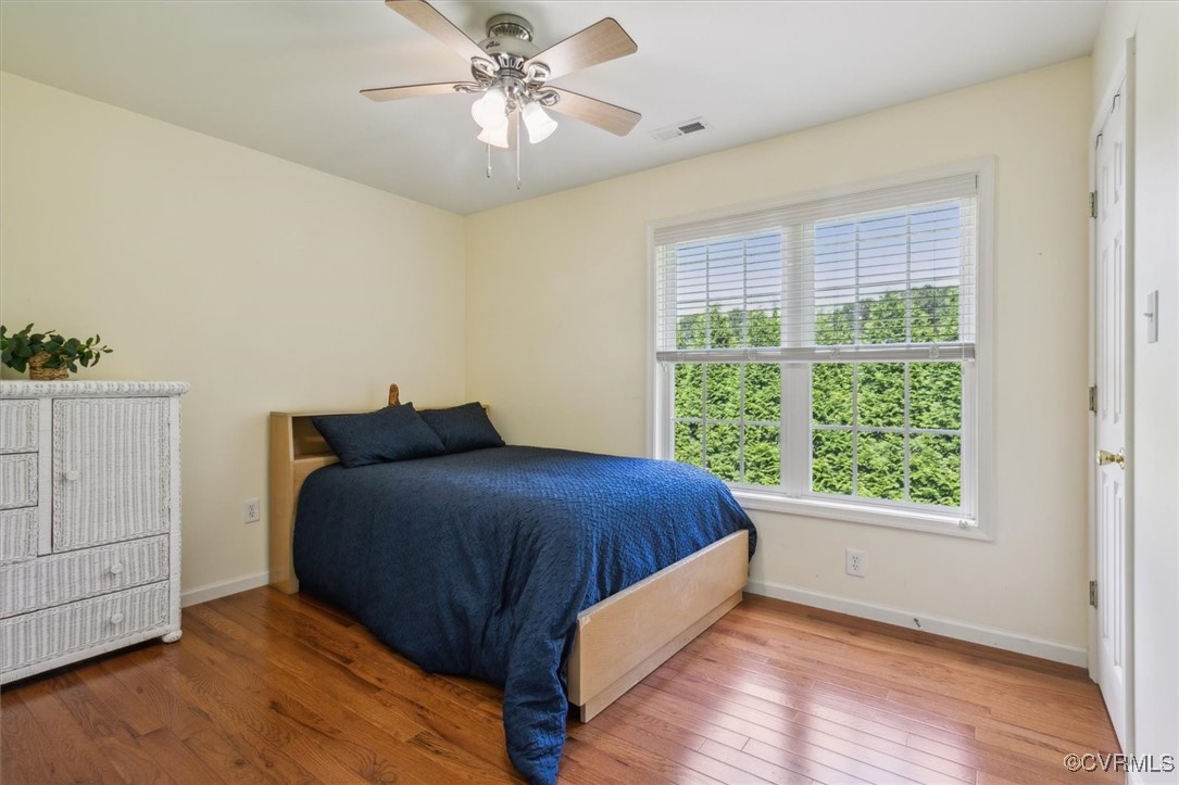 203 Oaktree Road, Unit A Williamsburg, VA 23188 - Photo 30 of 46 Bedroom featuring multiple windows, hardwood / woo