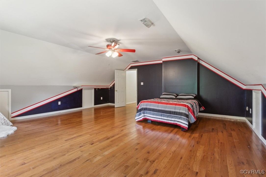 203 Oaktree Road, Unit A Williamsburg, VA 23188 - Photo 33 of 46 Bedroom with lofted ceiling, wood-type flooring, a
