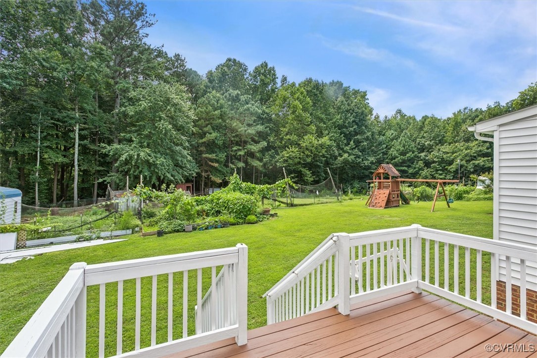 203 Oaktree Road, Unit A Williamsburg, VA 23188 - Photo 36 of 46 Wooden terrace with a trampoline, a playground, an