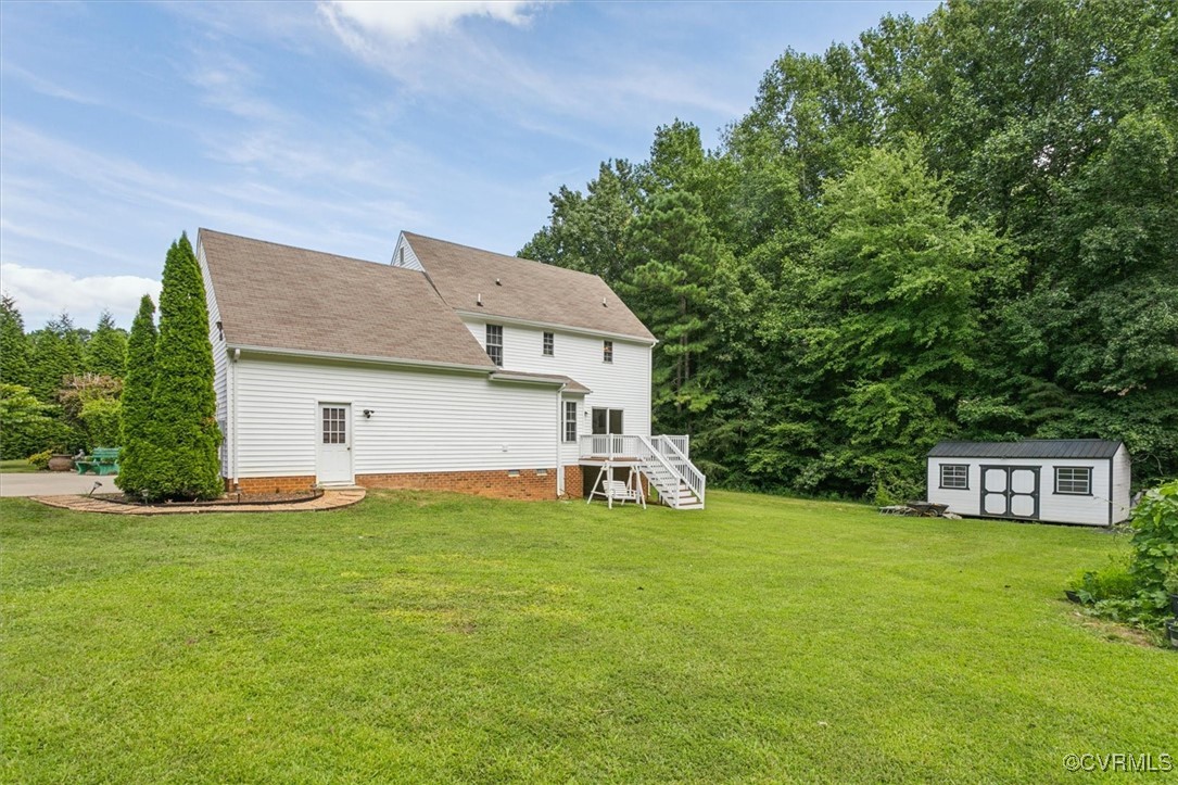 203 Oaktree Road, Unit A Williamsburg, VA 23188 - Photo 43 of 46 Back of property with a wooden deck, a yard, and a