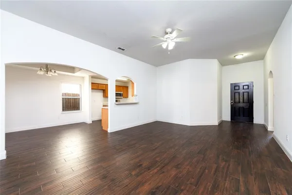 a view of a livingroom with wooden floor