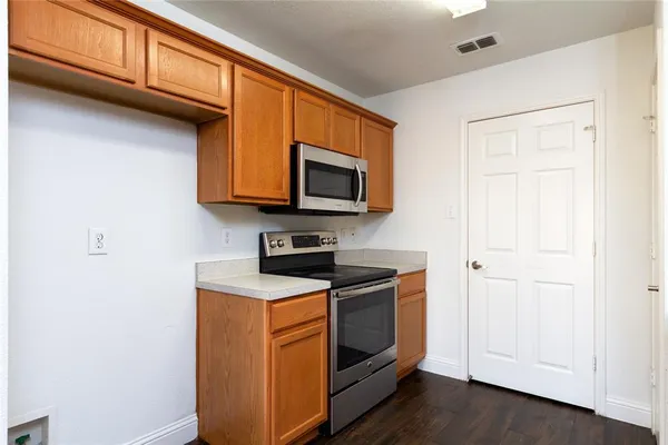 a view of a kitchen with microwave and stove