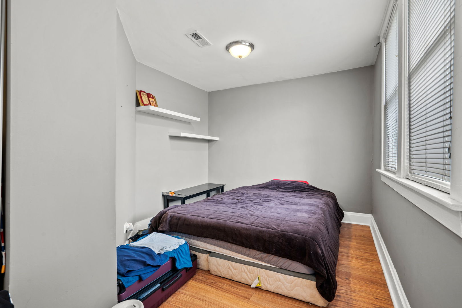 8103 46th Street Lyons, IL 60534 - Photo 11 of 14 a bedroom with a bed and a window