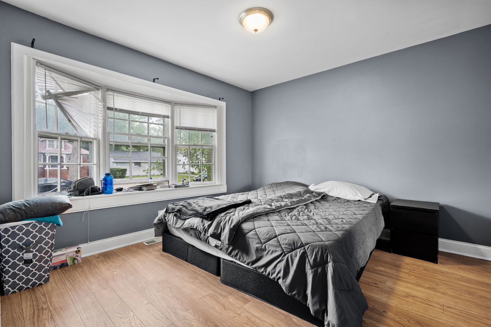 8103 46th Street Lyons, IL 60534 - Photo 14 of 14 a bed sitting in a bedroom next to a window