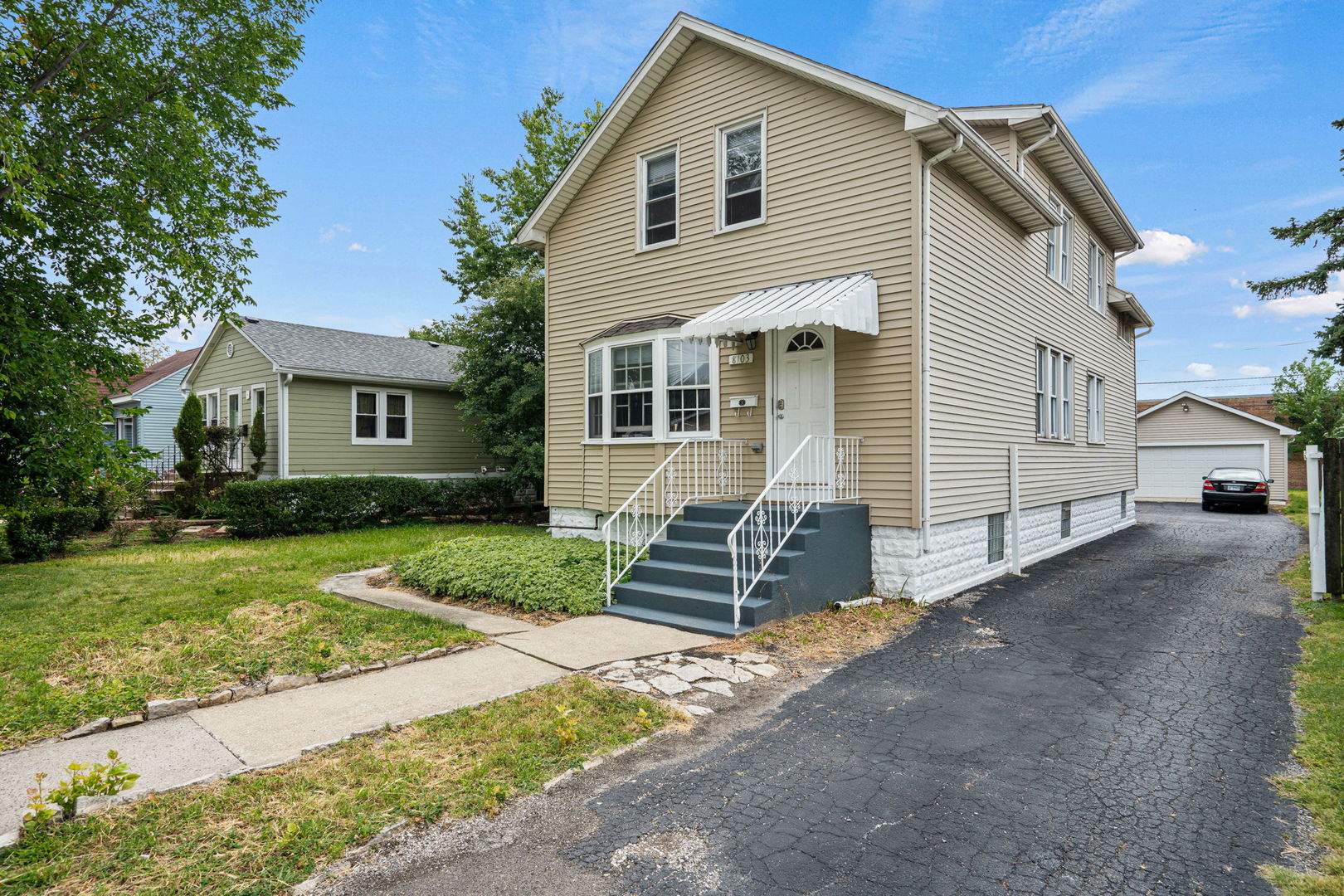 8103 46th Street Lyons, IL 60534 - Photo 4 of 14 a front view of a house with a yard