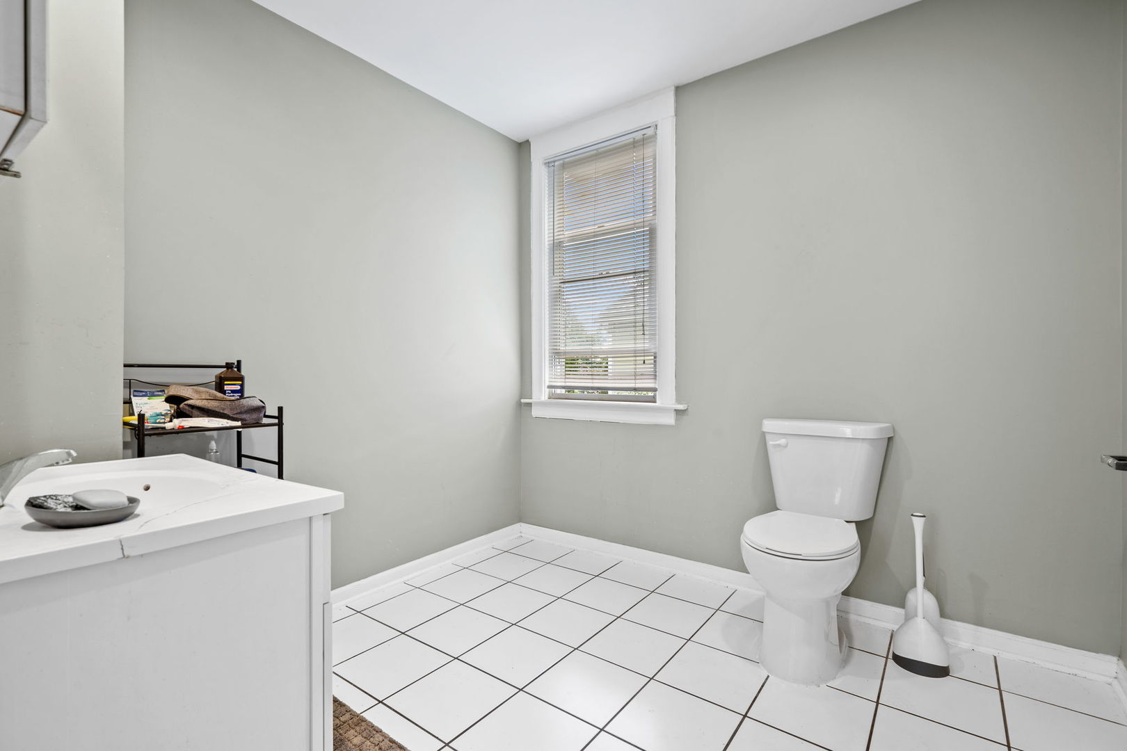 8103 46th Street Lyons, IL 60534 - Photo 10 of 14 a bathroom with a sink toilet and vanity