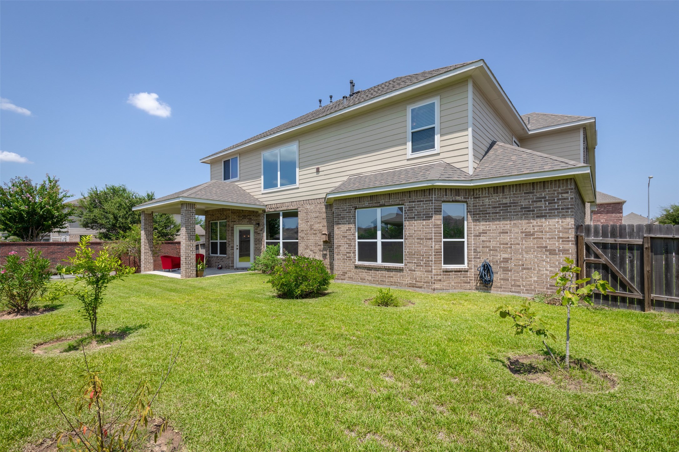 25023 Florina Ranch Drive Katy, TX 77494 - Photo 2 of 12 a front view of a house with a yard and garage