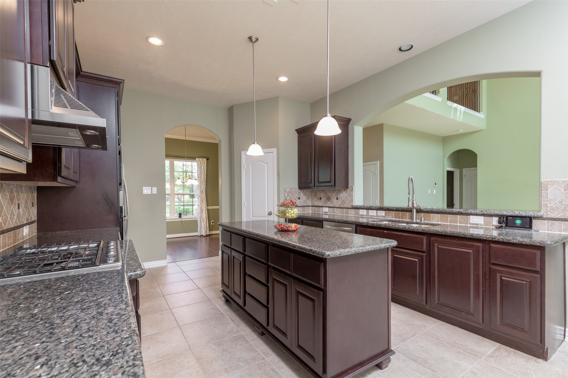 25023 Florina Ranch Drive Katy, TX 77494 - Photo 4 of 12 a kitchen with a sink and a stove