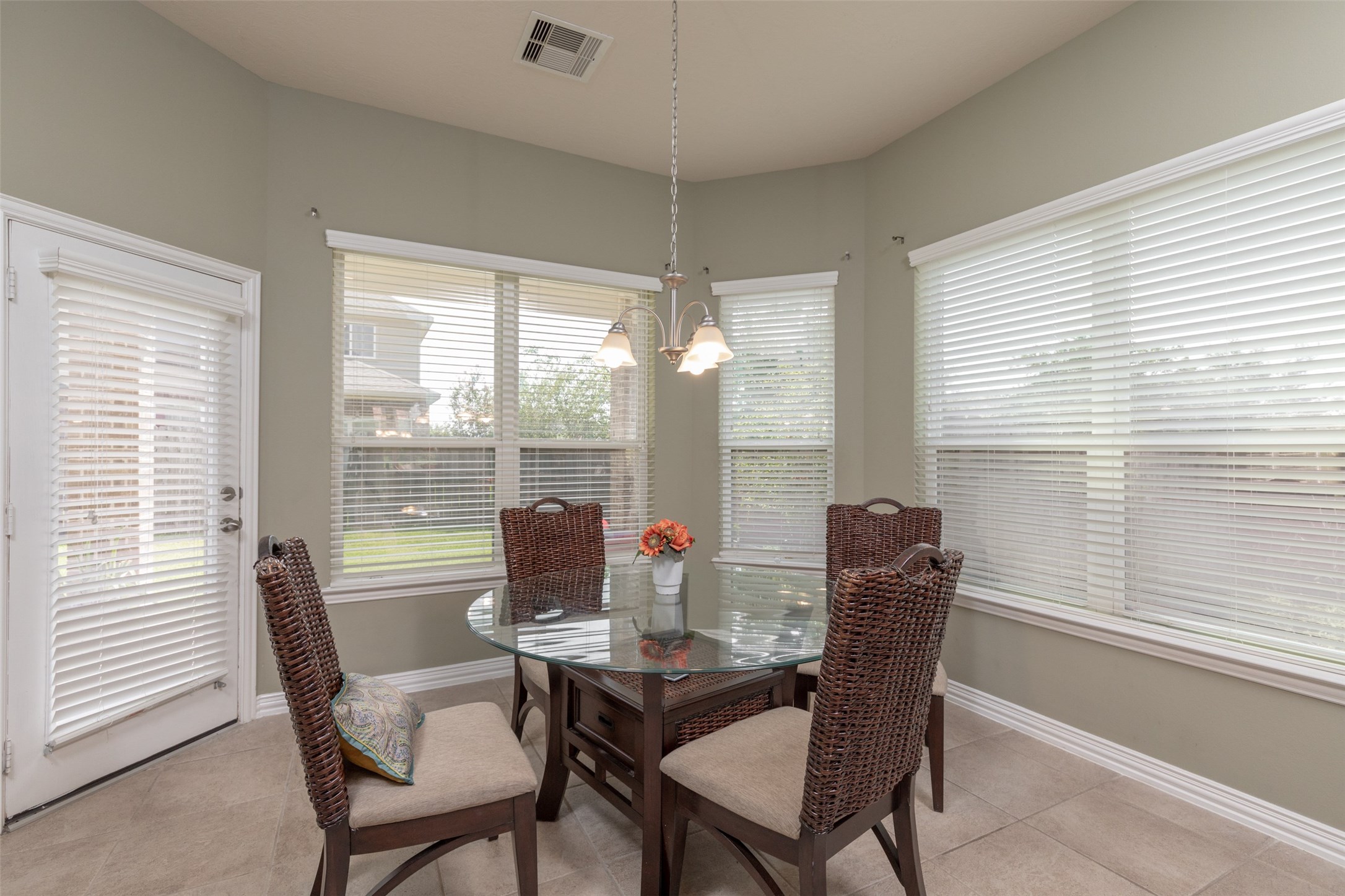 25023 Florina Ranch Drive Katy, TX 77494 - Photo 6 of 12 a dining room with furniture large windows and wooden floor