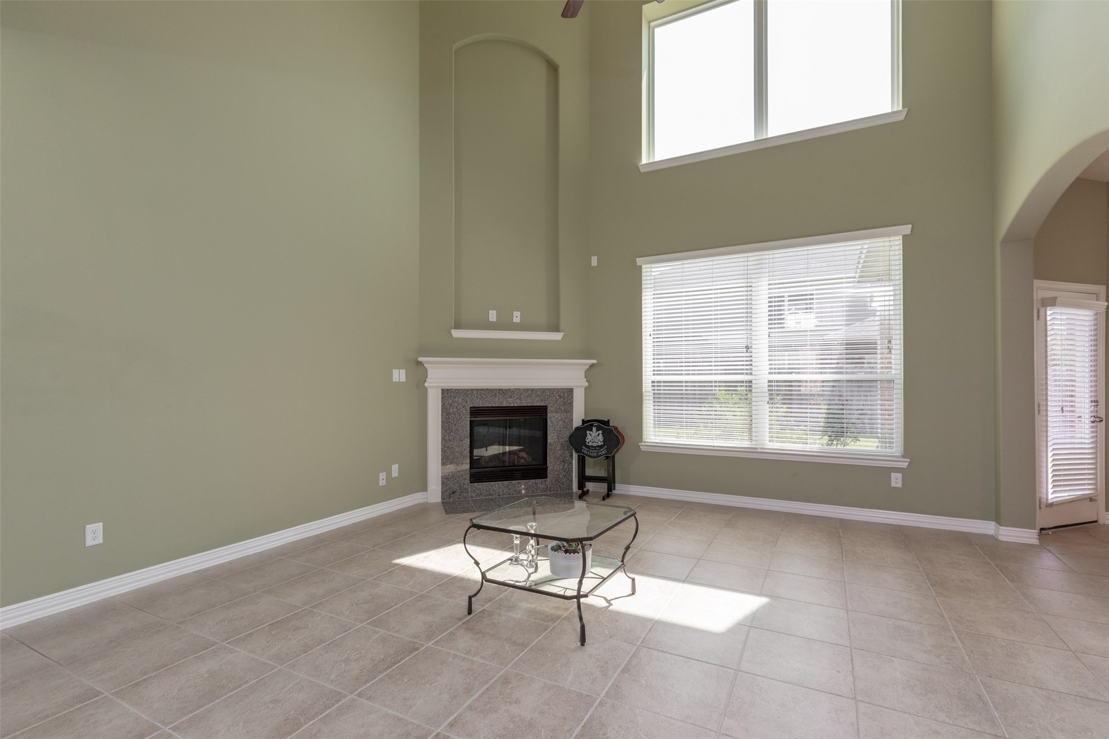 25023 Florina Ranch Drive Katy, TX 77494 - Photo 8 of 12 a living room with furniture a fireplace and a window