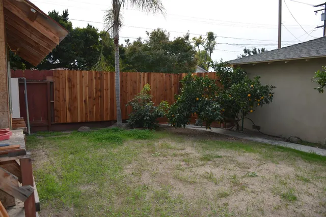 a backyard of a house with lots of green space