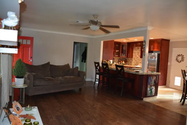 a view of a dining room with furniture and window